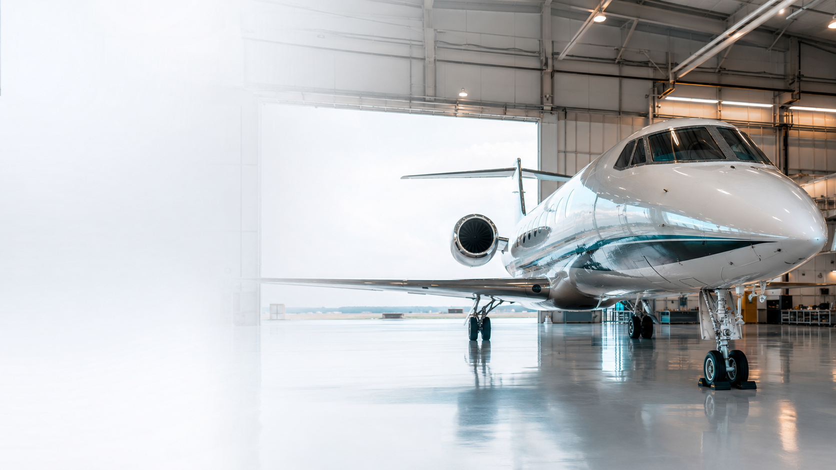 Modern aerospace hangar with a civilian business jet